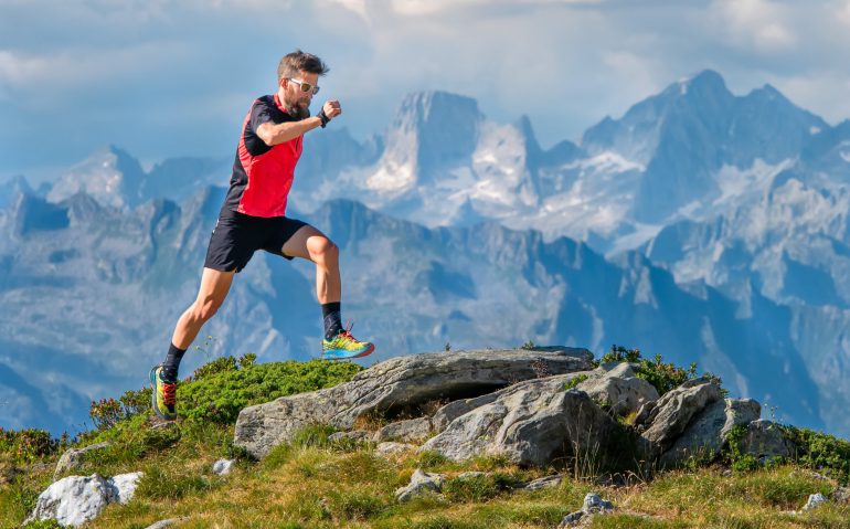 A skyrunner athlete man trains in the high mountains.